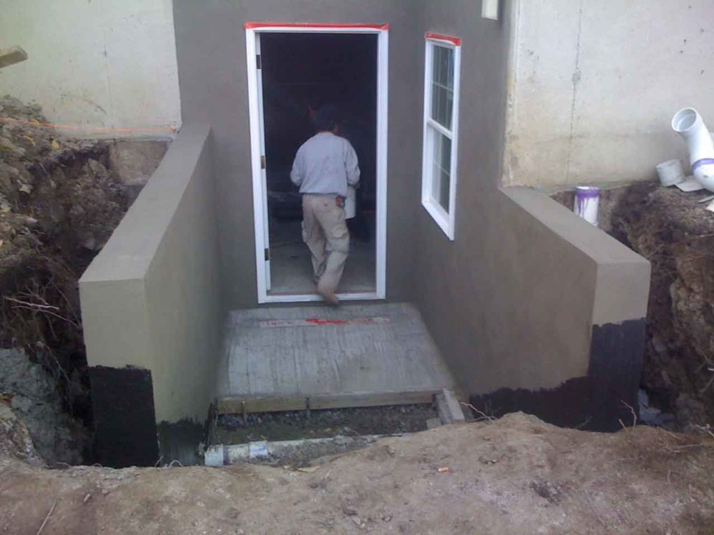 The worker is working on the Cleargress® basement permentry egress project