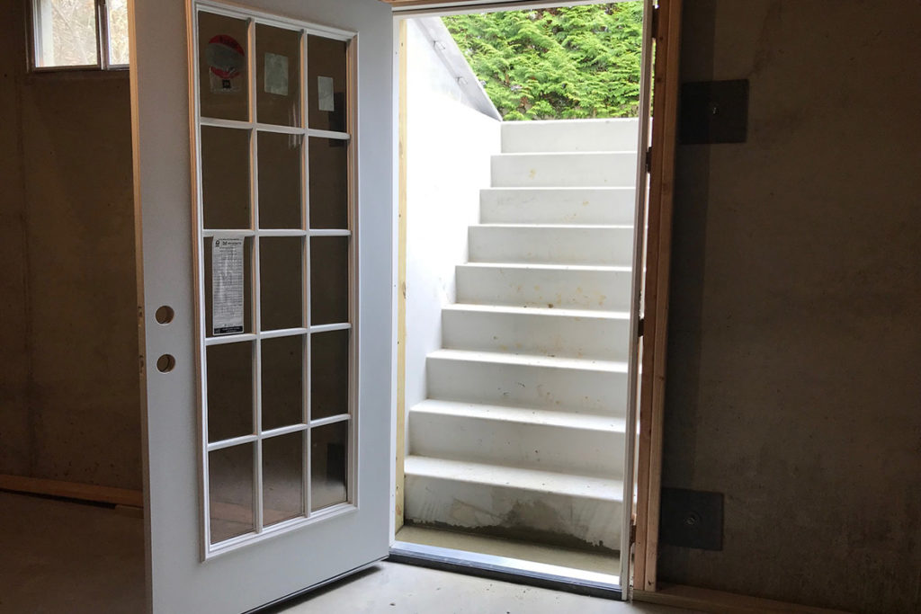 In process to install a Permentry precast concrete stair, with a Cleargress door, and a 3/0 x 6/8 insulated, 15 lite door at the base of the stair in TELEGRAPH ROAD, COATESVILLE