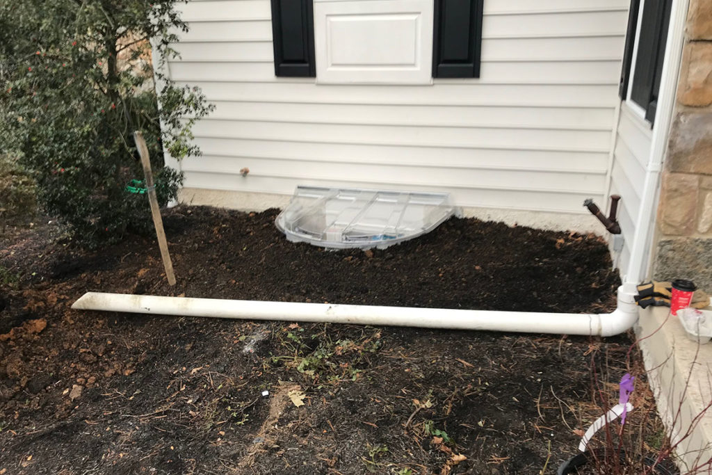 After installation of Wellcraft Model 5600 egress well, a Wellcraft polycarbonate cover, and a JeldWen, 30″ x 54″, egress compliant, casement window on the front of the house in NORTH HILL DRIVE, WEST CHESTER