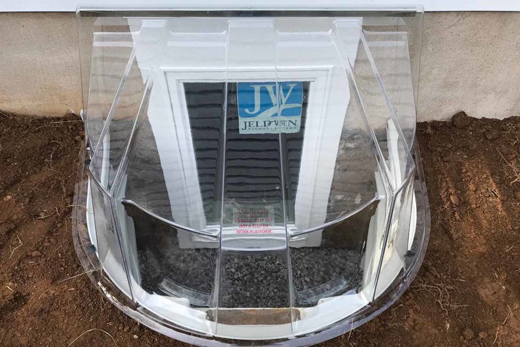 After installation of a Wellcraft model 5600 egress well, a Wellcraft polycarbonate dome style cover and a JeldWen egress compliant casement window in WIND SONG ROAD, WEST CHESTER