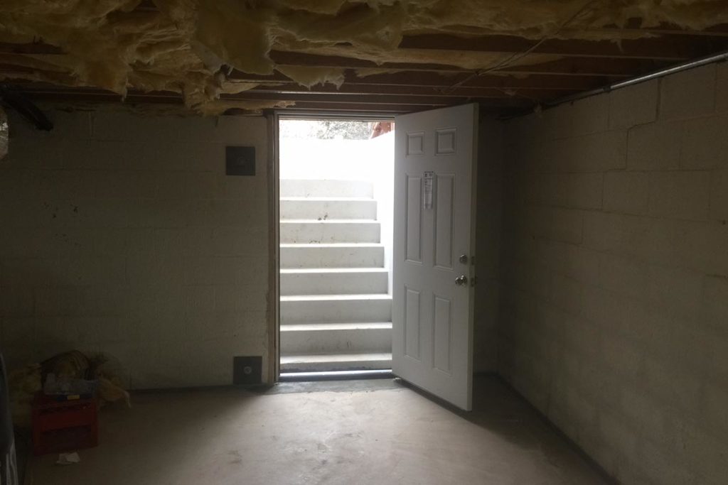 After installation of a Permentry precast concrete stair, with a Bilco door, and a 3/0 x 6/8 insulated six panel door at the base of the stair in BRYON DRIVE, RICHBORO