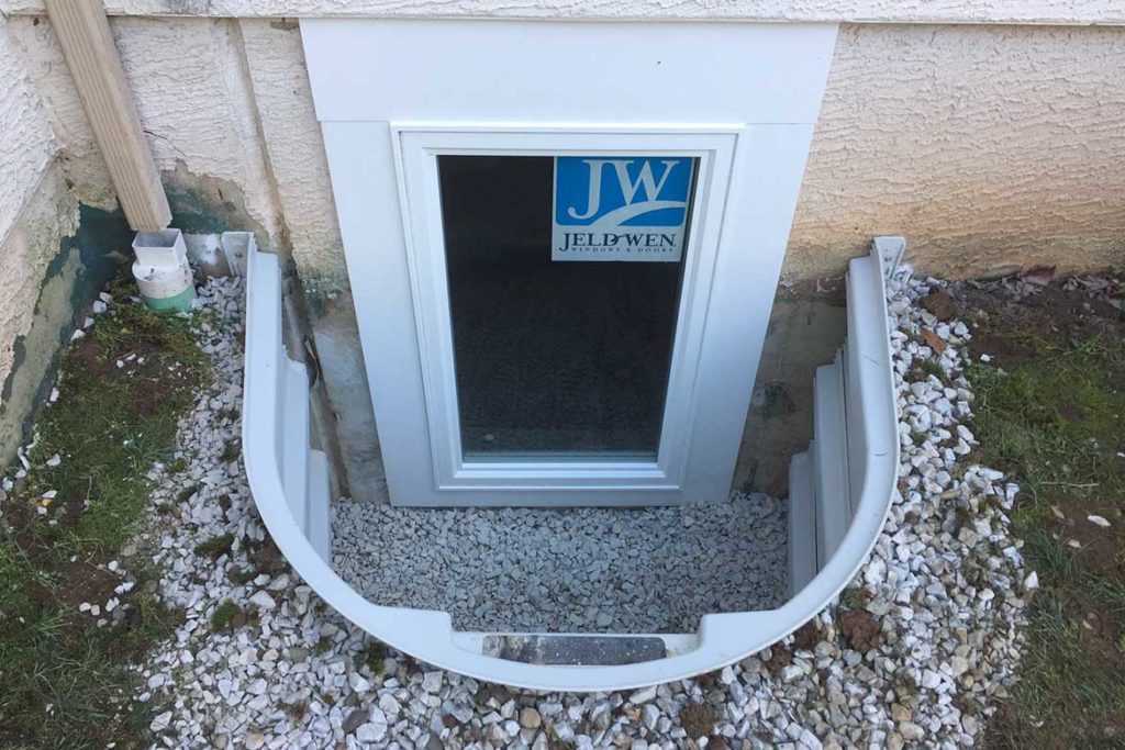 In process to install a Wellcraft model 5600 egress well, a Wellcraft polycarbonate dome cover and a JeldWen egress compliant casement window in PENN CROSSING, EAST NORRITON