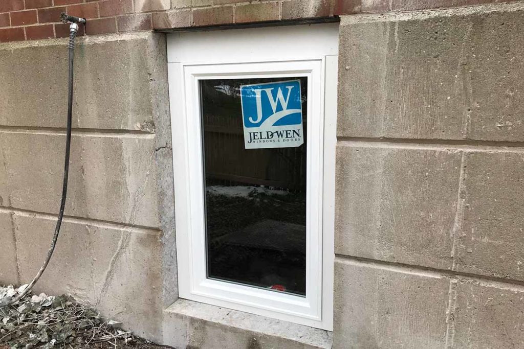 After installation of two JeldWen egress compliant casement windows in an above grade foundation to brighten up a rather dark basement in CAMBRIA COURT, SAINT DAVIDS
